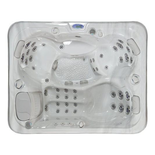 A top view image of the IOS650 3-person spa pool with lounge and upright seating, multiple jets and digital control panel.